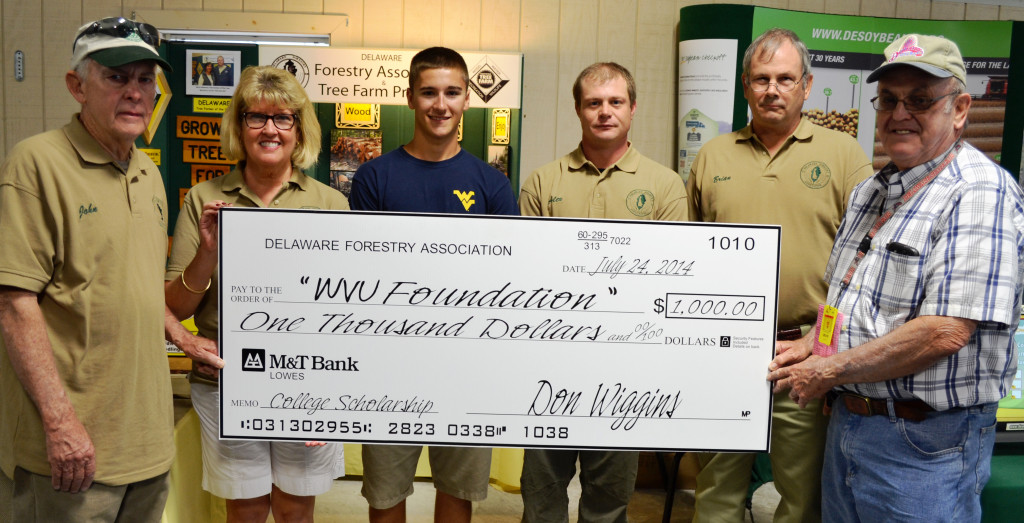 Luke Czapp (center), an 18-year-old studying forestry at West Virginia University, receives his $1000 scholarship award from the Delaware Forestry Association at the Delaware State Fair. On hand to present the award are DFA board members (from left) John Herbert, Leslie Merriken, Alex Fignar, Brian Michalski, and Bill Jester.
